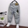 Spring 2025 Cool Children's Jeans Character Print Design New Arrival Kids' Denim Trousers for Boys